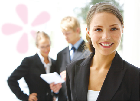 Business woman standing in front of office colleagues